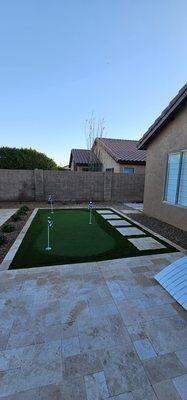 Finished, a very nice backyard with desert plants, rocks, planter, Turf and Golf.