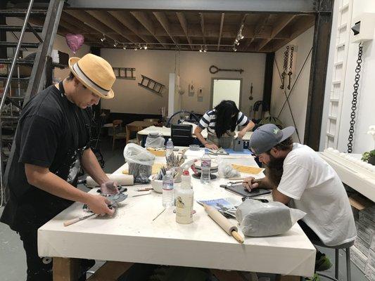 Students working on hand-building projects at Ceramic Social.