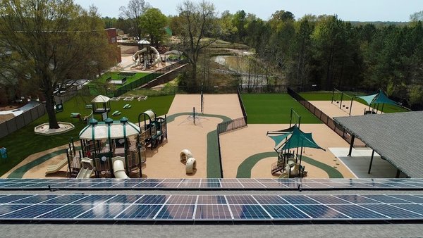 Aerial view of Playground Equipment/ Pond/ Solar Panels