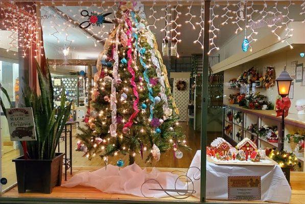 From Halos To Tiptoes storefront decorated for Christmas