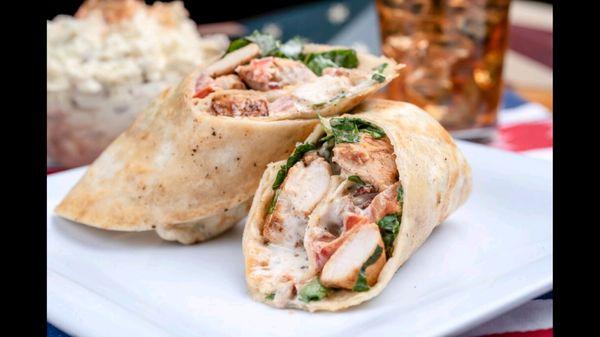 Grilled chicken, romaine lettuce, diced tomatoes, bacon, shredded cheddar and ranch dressing all wrapped in a buttery grilled tortilla.