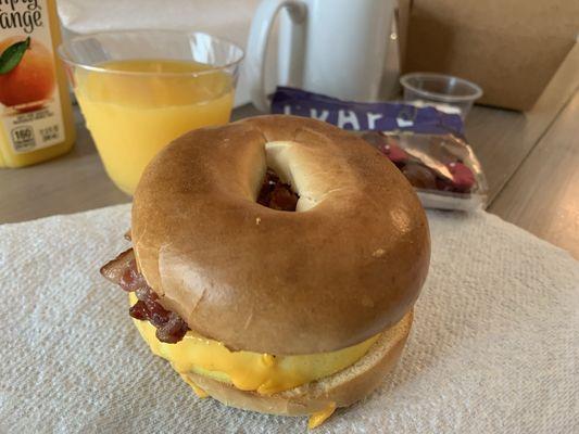 Bagel breakfast sandwich with bacon, cheese and egg