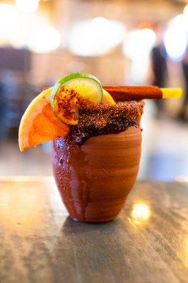 Our Famous Cantarito!!! Made with Gold Agave, Orange and Grapefruit Juice, Grapefruit Soda, Lime, Pinch of Salt.
Chamoy Rim.