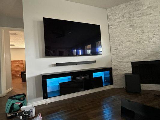 Home theatre installation, conceal wires mount tv floating tv stand with LED strip lighting