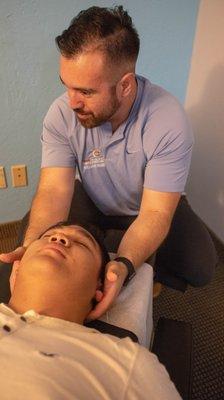 Cervical spine assessments ensure proper range of motion and kinetic chain integrity.