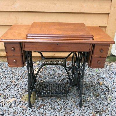 Turn of the century treadle sewing cabinet.