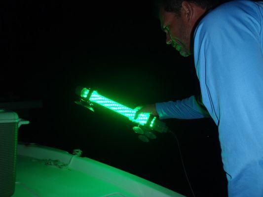 Dave Galloway using his Under water fish light designed by Underwaterfishlight.com owner John Molle to see lobster in the Florida Keys.