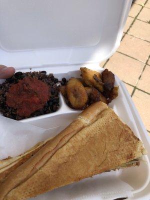 Cuban sandwich, black beans and rice topped with spicy salsa, and plantains.