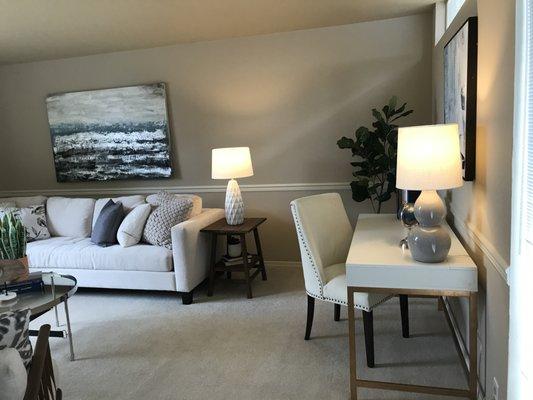 Long living room with weird spot at the end.  This desk was the perfect solution.