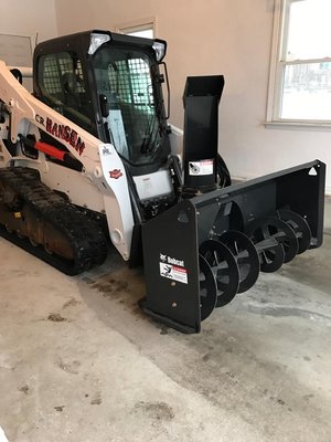 Our Bobcat with Snow blower.  Commercial Snowplowing Available.