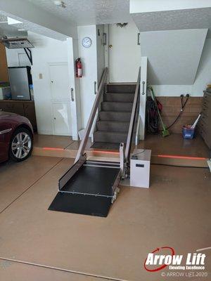 Custom install of an inclined wheelchair lift going from the garage to the home's main entrance.