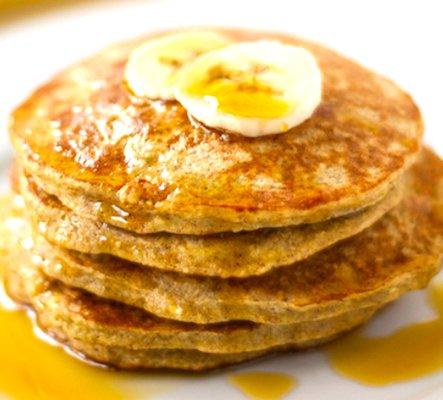 Our Banana Oat Pancakes are Gluten Free! Add blueberries, bananas, macadamia nuts, whip cream