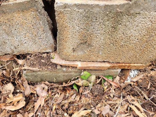 Neighbors retaining wall repair photo closeup