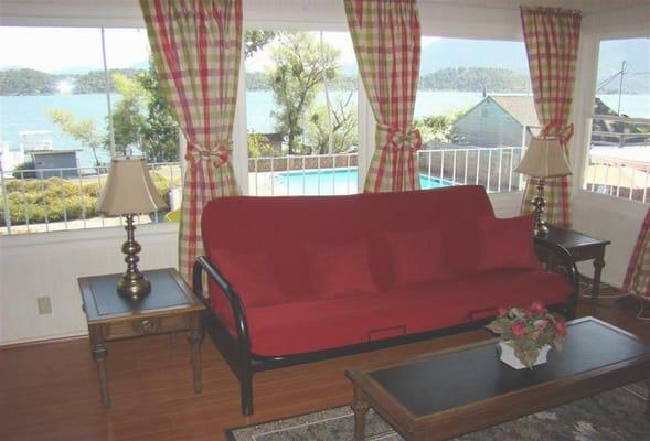 Veranda wall of windows looking at the lake.