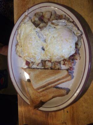 Breakfast special, Corned beef hash, eggs and toast.