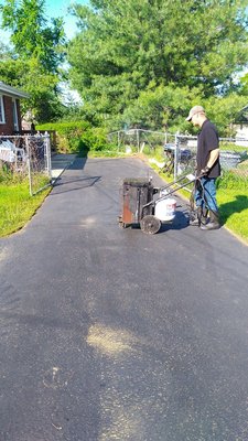 This is the proper way to repair cracks in your driveway using HOT rubber crack filling