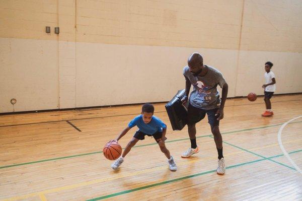 Coach 20 working with Landon Ekcles 5th Grade Point Guard. Bates Fundamentals Elite Basketball Team.