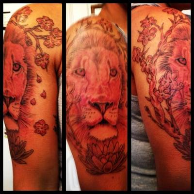 Awesome job on my lion tattoo with the cherry blossom & lotus flower. Touch up, coming soon!