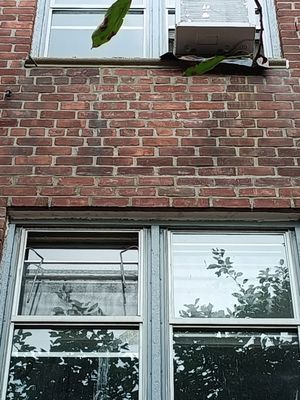 Removal of air conditioner sleeve and infill of bricks