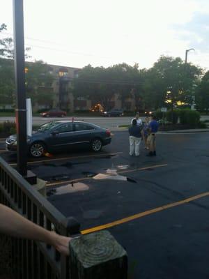 The woman charges the car owners $130 (to remove the boot) for parking in Ecodirect's parking lot, after Ecodirect is closed.