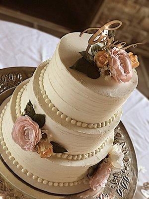 Traditional style wedding cake! Vanilla buttercream, with florals and custom topper!