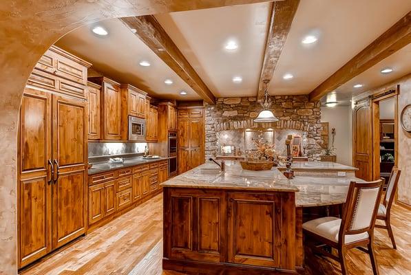 Wood finishes, granite counter tops and wood beams. www.Copperleafhomes.com