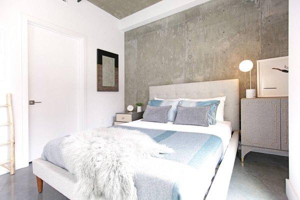 Bedrooms with concrete infused architecture.