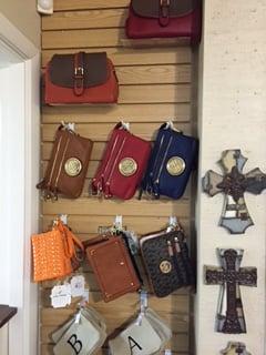 Stop on by and check out our new selection of clutch purses. We also have a variety of game day purses.