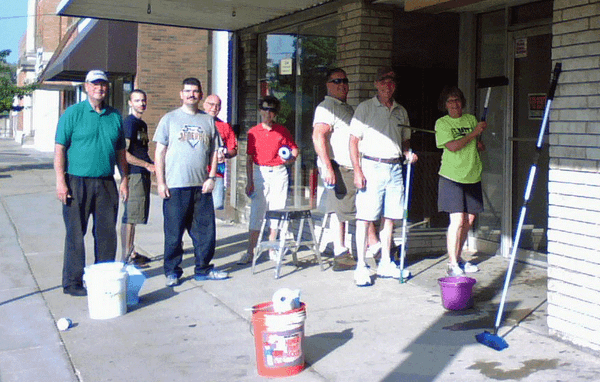 part of the volunteer group washing windows for local businesses.