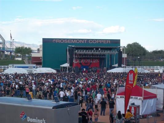 Food/drink vendors surround the field as well as set up above the seating.