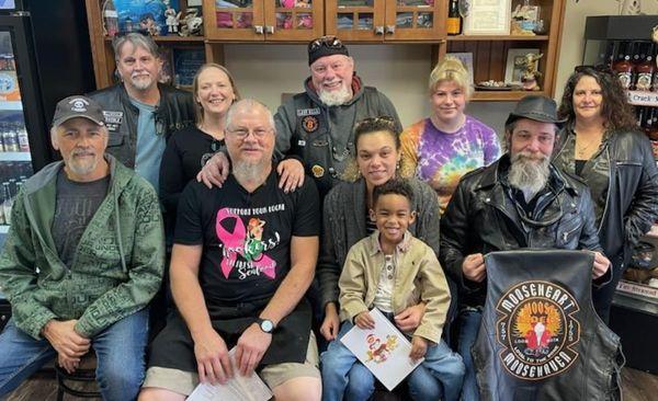 A 2022 grant recipient, Caitlin and her son with Uncle Russ and the Moose Riders, our most loyal supporters.