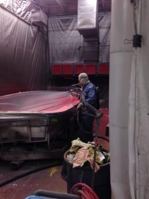 Step one in making a boat.  Spray the exterior colors into the mold.