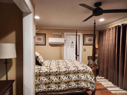 The Cottage bedroom; doors behind those curtains lead to a private patio