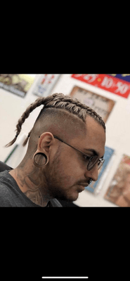 High skin fade with two braids