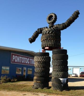 Look for the big tire man out front.