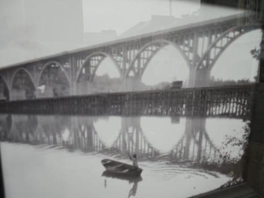 A shot of an historic photo of the Lee Bridge in the shop window