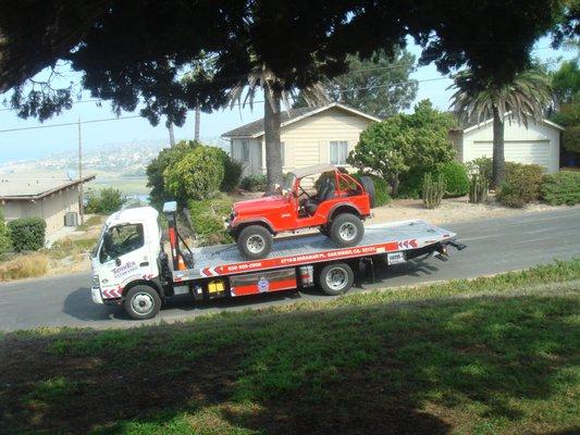 My 74 Jeep on the way to Hard Rock via Jeep ambulance.