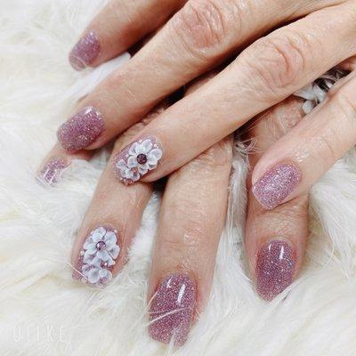 3D flower effect on nails.