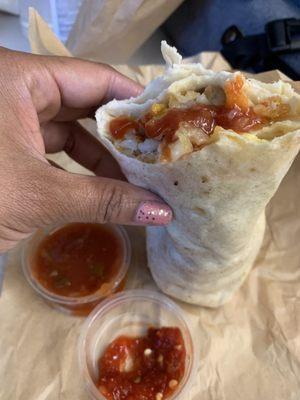 Bacon Breakfast Burrito with side of salsa and chili sauce