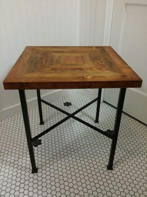 Small end table made from reclaimed and repurposed metal legs