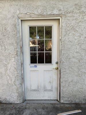 The kicked in front door that the owners have yet to fix