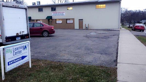 Door entrance at building side, parking area available