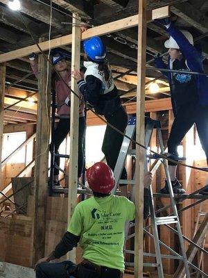 Volunteers building on one of our build sites