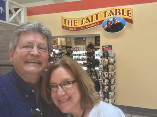 The founders, Dave and Carol stand in front of their shop located inside the TSA checkpoint at Savannah Hilton Head International Airport.