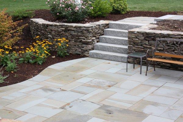 Bluestone patio with granite steps.