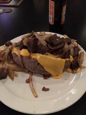 Baked potato with steak.