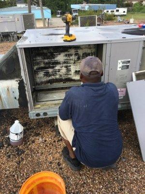 Our manager Chip performing a preventative maintenance on a commercial  RTU (roof top unit)