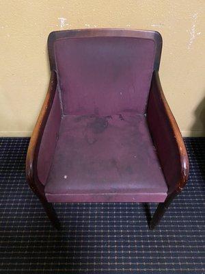 A chair with years of shit and stains