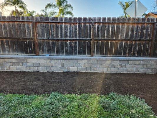 Beautiful retaining wall replaced a large raised planter bed in our back yard