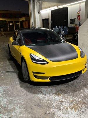 Yellow wrapped tesla